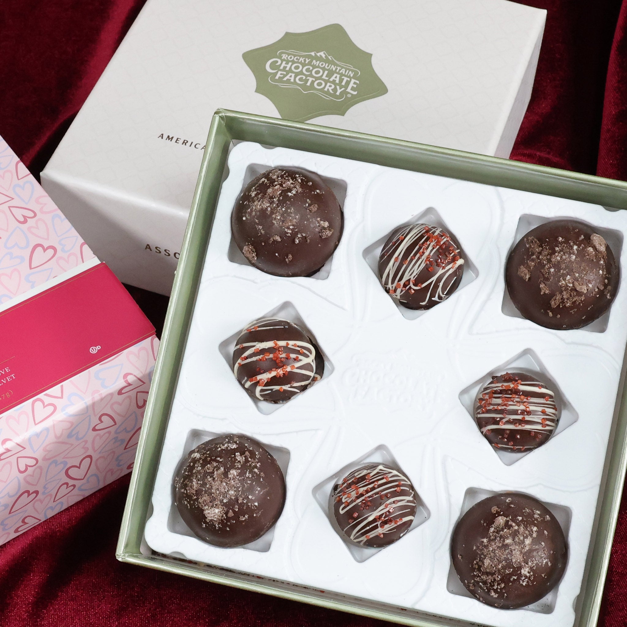Box of chocolate truffles with various toppings